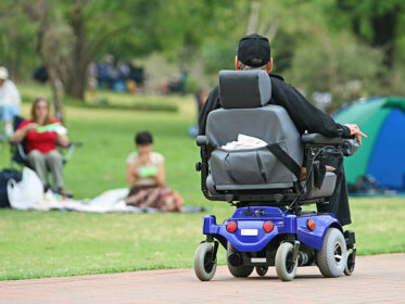 Disabled Man Enjoying A Ride In The Park